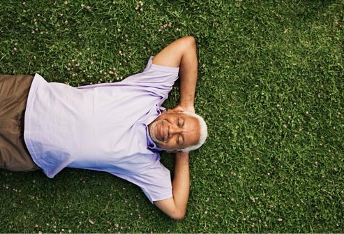 getty_rf_photo_of_man_laying_on_grass